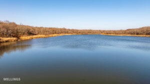 Stocked pond shoreline with wildlife habitat at The Floyd Ranch, OK