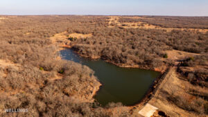 Stocked pond shoreline with wildlife habitat at The Floyd Ranch, OK