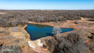 Stocked pond shoreline with wildlife habitat at The Floyd Ranch, OK