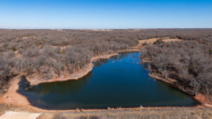Stocked pond shoreline with wildlife habitat at The Floyd Ranch, OK