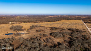 Wide aerial showing ranch boundary and grass pastures of The Floyd Ranch
