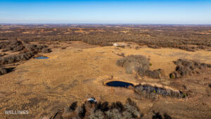 Wide aerial showing ranch boundary and grass pastures of The Floyd Ranch