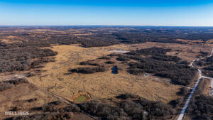 Wide aerial showing ranch boundary and grass pastures of The Floyd Ranch