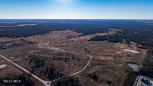 Wide aerial showing ranch boundary and grass pastures of The Floyd Ranch