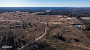 Wide aerial showing ranch boundary and grass pastures of The Floyd Ranch